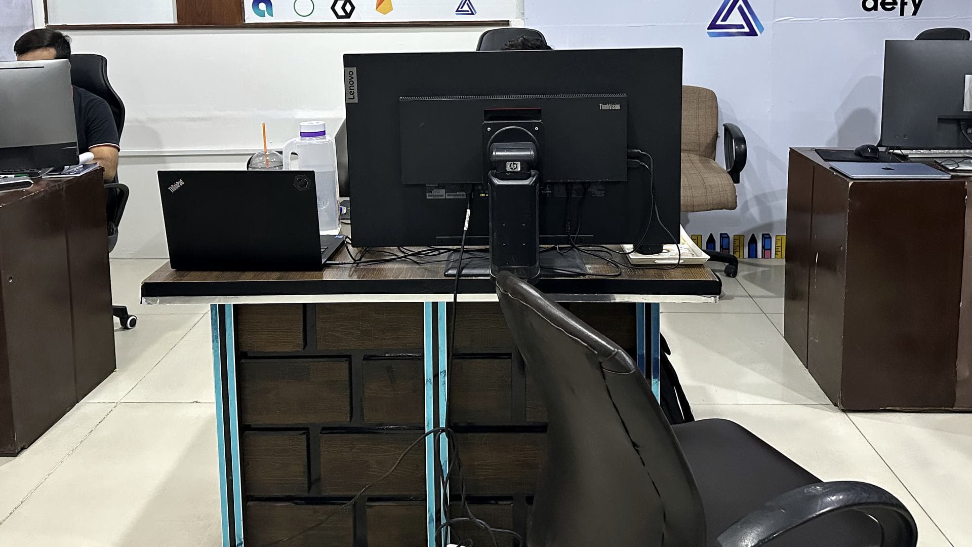 Three desks in the Faisalabad office.